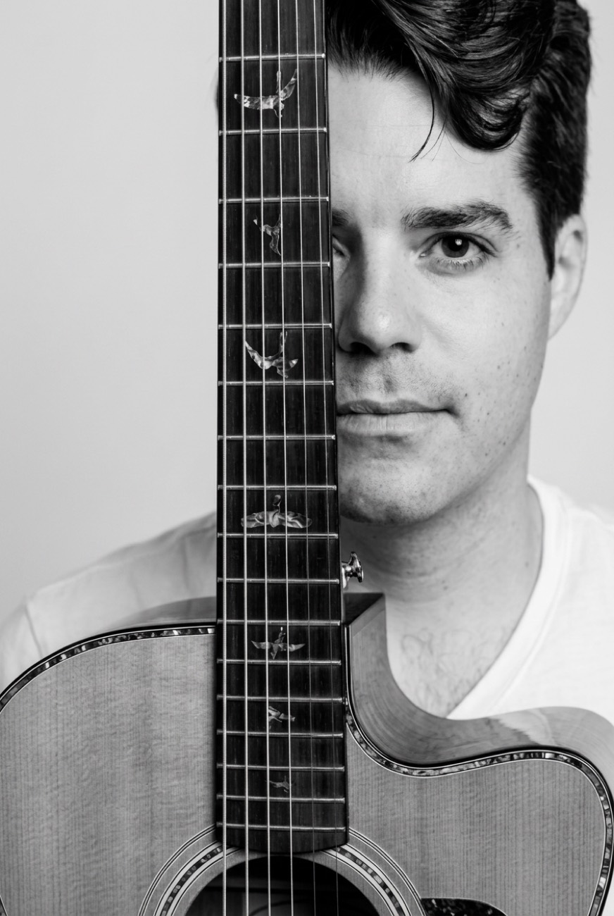 Stevie Matthews portrait with guitar